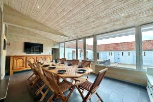 a large dining room with a table and chairs at Maison de charme - Jardin - BBQ - 10min du Crotoy in Rue