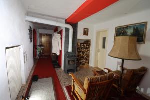 a living room with a couch and a fireplace at Ferienhaus Rieger in Mallnitz
