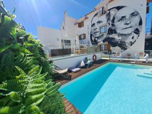 a swimming pool on the roof of a house at Casa do Joaquim da Praia in Nazaré