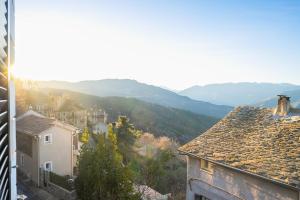 a view of a city with mountains in the background at U muntagna Olmo in Olmo