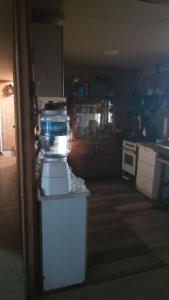 a kitchen with a stove and a counter top at Casa de campo in Colina