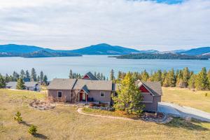 an image of a house with a view of a lake at Breathtaking Mtn & Lake Views! Glacier Country Gem in Dayton