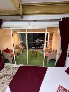 a bedroom with a view of a living room at Nile Star Suites &Apartment in Cairo