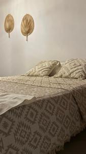 a bed with two headboards and pillows on it at Harama Living Finikas in Livanianá