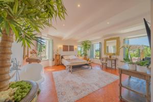a living room with a couch and a table at Maison Aimé in La Motte
