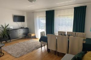 a living room with a table and a dining room at Apartment in Dabrowa near the Sea in Gostyniec