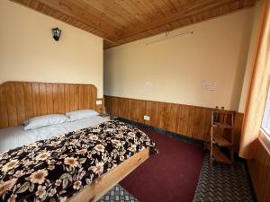 a bedroom with a bed in a room at Your Slow House in Shangarh +22 photos