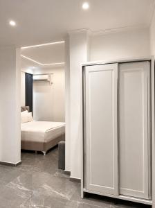 a bedroom with a bed and a sliding glass door at Vila Makla in Sarandë