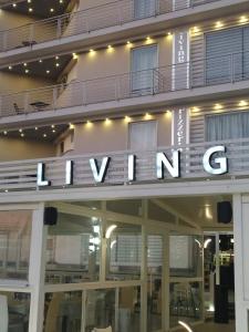 a sign on the side of a building with the wordounge at Hotel Living in Casoria +26 photos