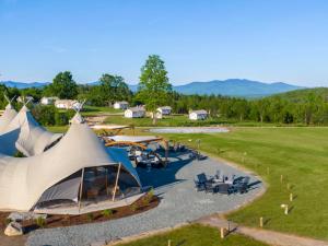 an aerial view of a camping site with a tent at Under Canvas White Mountains in Dalton