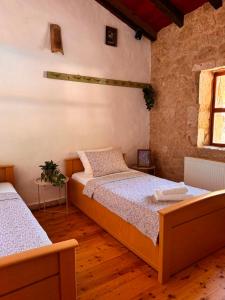 a bedroom with two beds and a window at Etno vila Međugorje in Čapljina +53 photos