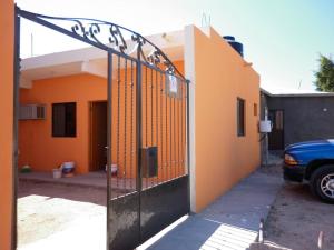 a gate in front of a house at Las Veredas Aeropuerto in San José del Cabo