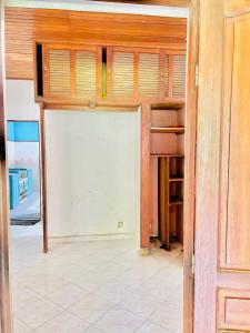 a garage with a white garage door in a room at Villa Rapide in Ambanja