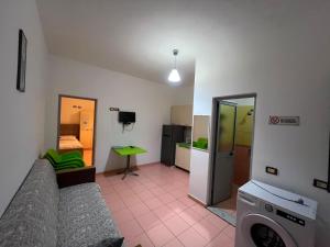 a living room with a couch and a table in a room at Ramadani Apartments in Velipojë