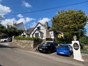 two cars parked in front of a house at The K Kinsale in Kinsale