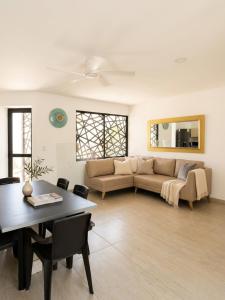 a living room with a couch and a table at Guantalamera Resort in Tubará