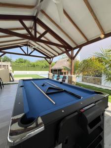 a pool table on the deck of a house at Guantalamera Resort in Tubará