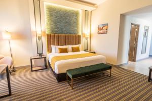 a large hotel room with a bed and a couch at Sonesta Hotel Arequipa in Arequipa