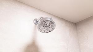 a shower head in the corner of a bathroom at Holiday Inn Orizaba by IHG in Orizaba