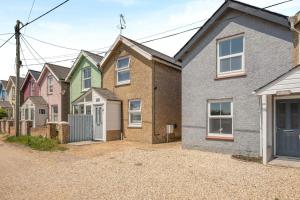 a row of houses on a gravel driveway at 2 Bed in Bembridge oc-p34174 in Bembridge