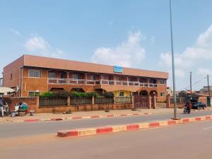 a building on the side of a street at Hôtel Les Pyramides in Yaoundé