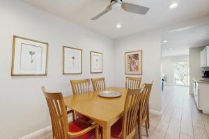 a dining room with a wooden table and chairs at San Clemente - Villa Del Mar in San Clemente
