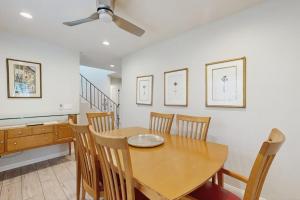 a dining room with a wooden table and chairs at San Clemente - Villa Del Mar in San Clemente