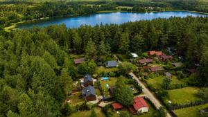 an aerial view of a house with a lake at Chëczka - 2min do Jeziora in Zbychowo