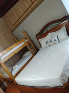 a bedroom with a bed and a bunk bed at 2 Pools - Solar - Playa Santa - Apto E in Guanica +41 photos