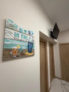 a painting hanging on a wall in a room at Catalano Suite Giada - Vista Mare in Palermo