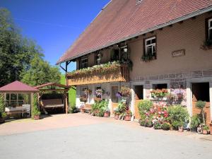 a building with flowers on the side of it at Glashof in Sankt Georgen im Schwarzwald