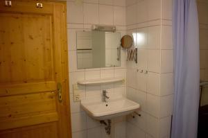 a bathroom with a sink and a mirror at Glashof in Sankt Georgen im Schwarzwald +41 photos