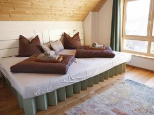two beds with stuffed animals on top of them in a room at Chalet Gipfelduo in Ebene Reichenau