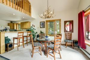 a kitchen and dining room with a table and chairs at 'Marble Hideaway' Cabin w/ Mountain Views + Deck! in Marble