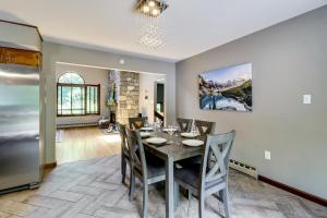 a dining room with a table and chairs at Lake Access & Private Hot Tub at Poconos Home! in White Haven