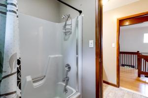 a shower in a bathroom next to a door at Lake Access & Private Hot Tub at Poconos Home! in White Haven +38 photos