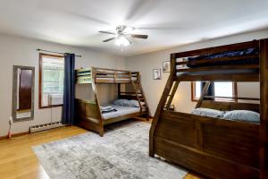 a room with two bunk beds and a ceiling fan at Lake Access & Private Hot Tub at Poconos Home! in White Haven