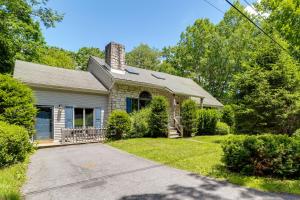 a brick house with a chimney and a driveway at Lake Access & Private Hot Tub at Poconos Home! in White Haven
