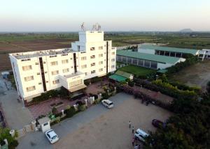 an overhead view of a building with a parking lot at Vinay Residency in Sindhnūr