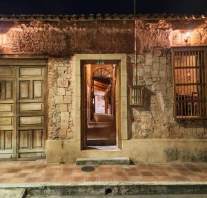 an entrance to a building with a wooden door at Casa Orígenes Hotel Boutique in Pamplona