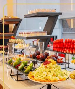 a buffet with many plates of food on a table at Marchica Hotel in Nador