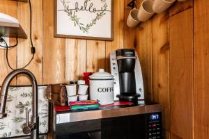 a coffeemaker sitting on top of a kitchen counter at Hill Country Cabin 4 in Canyon Lake