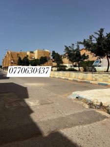 a street with a sign on the side of the road at مستغانم حي السلام المجدوب in Sidi Mohammed Medjoub