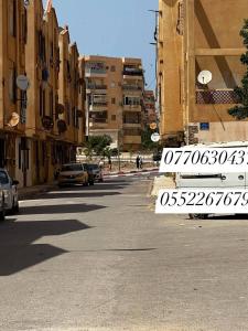 a street with cars parked on the side of the road at مستغانم حي السلام المجدوب in Sidi Mohammed Medjoub