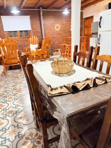 a dining room with a table and some chairs at Alojamiento en Barreal, San Juan in Barreal