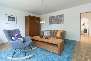 a living room with a couch and a coffee table at Treibholz in Schönberg