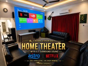 a room with a home theater with a large screen at Bergstein Taiping in Taiping