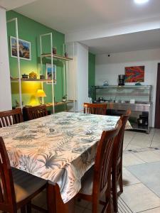 a dining room with a large table and chairs at KAD Alojamiento in Mendoza +9 photos