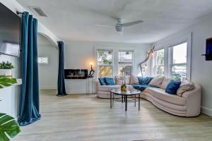 a living room with a couch and a table at Charming St Augustine Oasis with Game Room for Family fun in St. Augustine