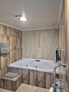 a bathroom with a large tub in a room at Hotel Boutique Casona Violeta in San Carlos +26 photos